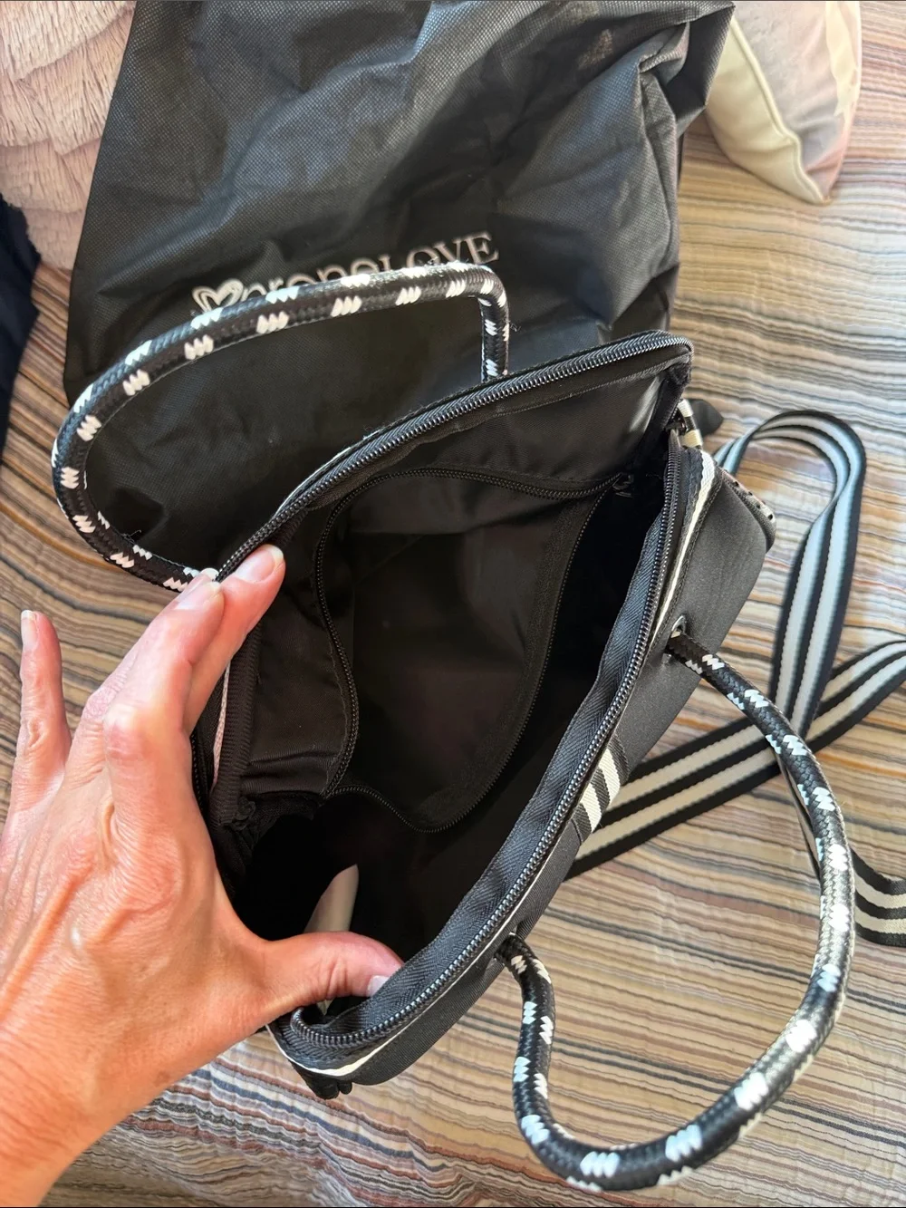 Black Crossbody Barrel Bag with Cream-Striped Accent